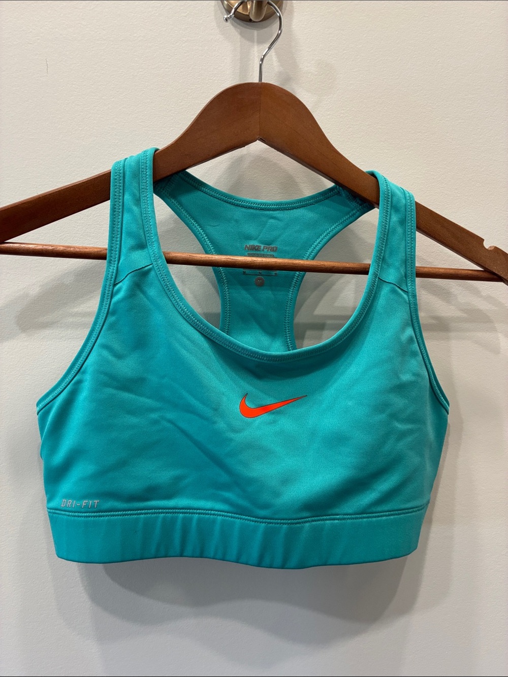 Nike Teal Sports Bra with Orange Swoosh